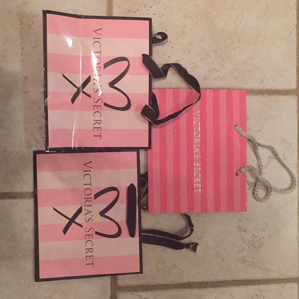 4 SMALL VICTORIA'S SECRET BAGS - willing to sep.